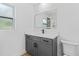 Modern bathroom with grey vanity and quartz countertop at 1638 Frances Dr, Apopka, FL 32703