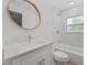 Clean bathroom with white vanity and marble shower at 1638 Frances Dr, Apopka, FL 32703