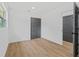 Bright bedroom with gray doors and wood-look floors at 1638 Frances Dr, Apopka, FL 32703