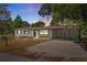 Newly renovated home with carport and landscaped yard at 1638 Frances Dr, Apopka, FL 32703