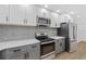 Modern kitchen with stainless steel appliances and gray cabinets at 1638 Frances Dr, Apopka, FL 32703