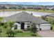 Aerial view of a single-Gathering home with a lake view and a large backyard at 17608 Sailfin Dr, Orlando, FL 32820