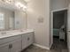 Clean bathroom with double vanity and access to bedroom at 17608 Sailfin Dr, Orlando, FL 32820