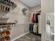 Large walk-in closet with custom shelving and hanging rods at 17608 Sailfin Dr, Orlando, FL 32820