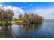 Waterfront lot with a private dock and mature trees at 17608 Sailfin Dr, Orlando, FL 32820