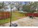 Backyard with patio, basketball hoop, and play area at 2058 Newtown Rd, Groveland, FL 34736