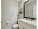 Simple bathroom with vanity, toilet and mirror at 2058 Newtown Rd, Groveland, FL 34736