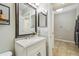 Small bathroom with vanity, mirror, and tiled floor at 2058 Newtown Rd, Groveland, FL 34736