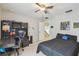 Bedroom with full bed, desk, and ceiling fan at 2058 Newtown Rd, Groveland, FL 34736