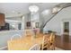 Dining room features a wood table and chairs, and view into kitchen at 2058 Newtown Rd, Groveland, FL 34736