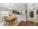 Bright dining area with wood table and chairs near kitchen at 2058 Newtown Rd, Groveland, FL 34736