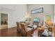 Relaxing living room with hardwood floors and large windows at 2058 Newtown Rd, Groveland, FL 34736