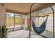 Relaxing screened patio with hammock and potted plants at 2058 Newtown Rd, Groveland, FL 34736