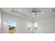 Bright bedroom with high ceilings, ceiling fan and large windows at 208 Snowy Orchid Way, Lake Alfred, FL 33850