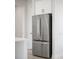 Stainless steel built-in refrigerator in kitchen at 208 Snowy Orchid Way, Lake Alfred, FL 33850