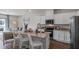 Open concept kitchen with island, looking into the living room at 2211 Tongass Bnd, Davenport, FL 33896