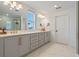 Modern bathroom with double vanity and gold accents at 2338 Gold Dust Dr, Minneola, FL 34715