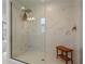 Large walk-in shower with marble tile and glass enclosure at 2338 Gold Dust Dr, Minneola, FL 34715