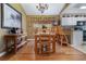 Dining room with hardwood floors, wooden table and chairs at 2368 Monaco Cove Cir, Orlando, FL 32825