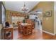 Bright dining room features a wood table with chairs and hardwood floors at 2368 Monaco Cove Cir, Orlando, FL 32825