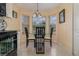 Kitchen breakfast nook with a round glass table and three chairs at 2368 Monaco Cove Cir, Orlando, FL 32825