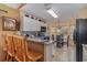 Kitchen features granite countertops and black appliances at 2368 Monaco Cove Cir, Orlando, FL 32825