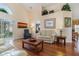 Living room with hardwood floors, couches, and a coffee table at 2368 Monaco Cove Cir, Orlando, FL 32825