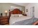 Main bedroom with a large bed and wood furniture at 2368 Monaco Cove Cir, Orlando, FL 32825