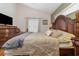 Main bedroom with a king-size bed and hardwood floors at 2368 Monaco Cove Cir, Orlando, FL 32825