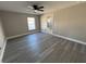 Spacious bedroom with wood-look flooring and en-suite bathroom at 2413 Rock Ct, Poinciana, FL 34759