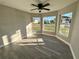 Bright sunroom with wood-look flooring and multiple windows at 2413 Rock Ct, Poinciana, FL 34759