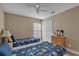 Twin bedroom with two beds, dresser, and TV at 2661 Emerald Island Blvd, Kissimmee, FL 34747