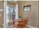 Small breakfast nook with wooden table and chairs at 2661 Emerald Island Blvd, Kissimmee, FL 34747