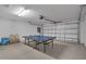 Fun game room in garage with ping pong table at 2661 Emerald Island Blvd, Kissimmee, FL 34747