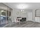 Bright dining room with gray chairs and a view to the balcony at 2705 Maitland Crossing Way # 5-107, Orlando, FL 32810