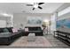 Living room with gray sectional sofa and wood floors at 2705 Maitland Crossing Way # 5-107, Orlando, FL 32810