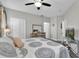 Main bedroom with king-size bed, dresser, and access to closets at 2705 Maitland Crossing Way # 5-107, Orlando, FL 32810