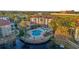 Community pool and lake with surrounding condos at 2705 Maitland Crossing Way # 5-107, Orlando, FL 32810