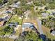 Expansive aerial view of a property in a residential area, showcasing its well-manicured lawn and proximity to neighborhood amenities at 280 E Constance Rd, Debary, FL 32713