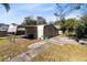 Exterior view of a detached garage or shed and carport in the backyard at 280 E Constance Rd, Debary, FL 32713