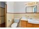 Retro bathroom featuring tiled walls, a shower and vanity with wood drawers at 280 E Constance Rd, Debary, FL 32713