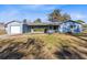 Ranch style home with blue exterior, attached garage, and spacious yard at 280 E Constance Rd, Debary, FL 32713