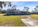 Front view of a light blue ranch house at 280 E Constance Rd, Debary, FL 32713