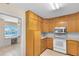 Cozy kitchen featuring stainless steel appliances, wooden cabinetry, and eat-in area at 280 E Constance Rd, Debary, FL 32713