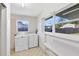 Laundry room with washer, dryer, and built-in bench at 280 E Constance Rd, Debary, FL 32713