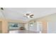 Bright living room features recessed lighting, ceiling fan, neutral walls and tile floor throughout at 280 E Constance Rd, Debary, FL 32713