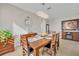 Formal dining room with a beautiful wooden table and a view into the kitchen at 2950 Sonata Ct, Saint Cloud, FL 34772