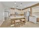 Bright kitchen featuring an island and white cabinets at 2950 Sonata Ct, Saint Cloud, FL 34772