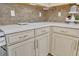 Corner kitchen with white cabinets and quartz countertops at 2950 Sonata Ct, Saint Cloud, FL 34772