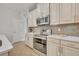 Well-equipped kitchen featuring stainless steel appliances and white cabinetry at 2950 Sonata Ct, Saint Cloud, FL 34772